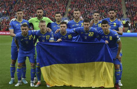 Ukraine soccer gifted flag by soldiers before World Cup qualifier