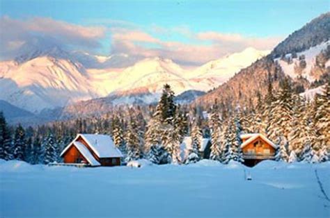 Winter ski cabins in snow with Chugach Mountains – Natural Building Blog