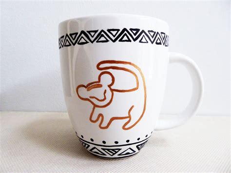 a coffee cup with an elephant drawn on it