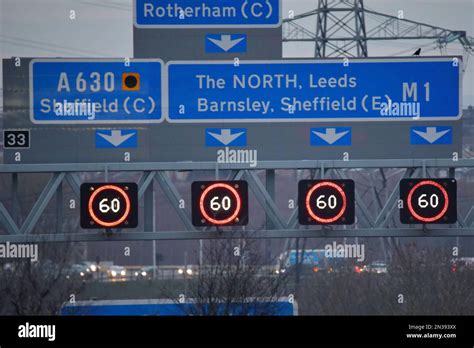 Signs and variable speed limits above each lane of the m1 motorway junction 33 Stock Photo - Alamy