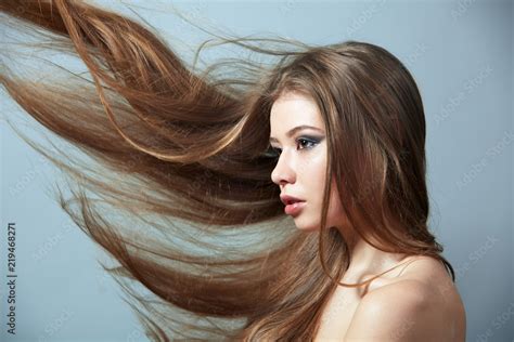 Girl with flying hair Stock Photo | Adobe Stock