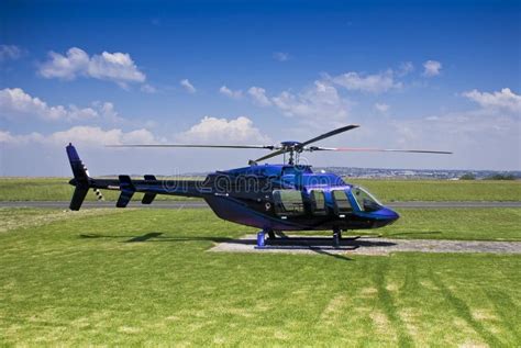 Bell 407 Helicopter - Parked On Helipad Stock Photo - Image of airfield ...