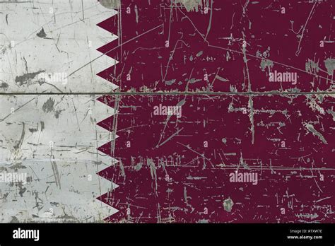 Grunge Qatar flag on old scratched wooden surface. National vintage background Stock Photo - Alamy