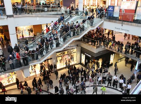 busy crowd inside shopping mall multi level Stock Photo - Alamy