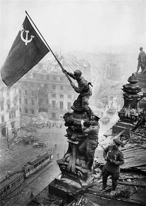 Soviet soldiers raises soviet flag over the Reichstag, Berlin, Germany ...