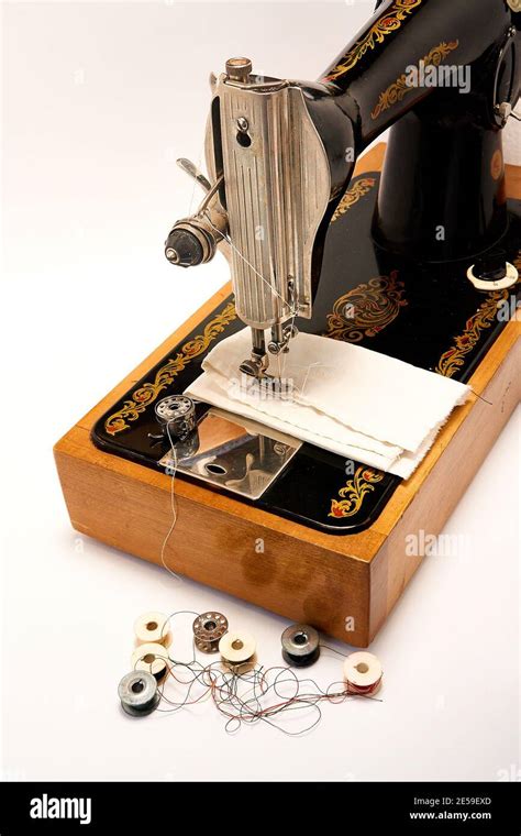 Sewing machine and parts on a white background Stock Photo - Alamy