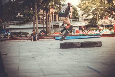 Boy Skateboarding Grayscale Photography · Free Stock Photo