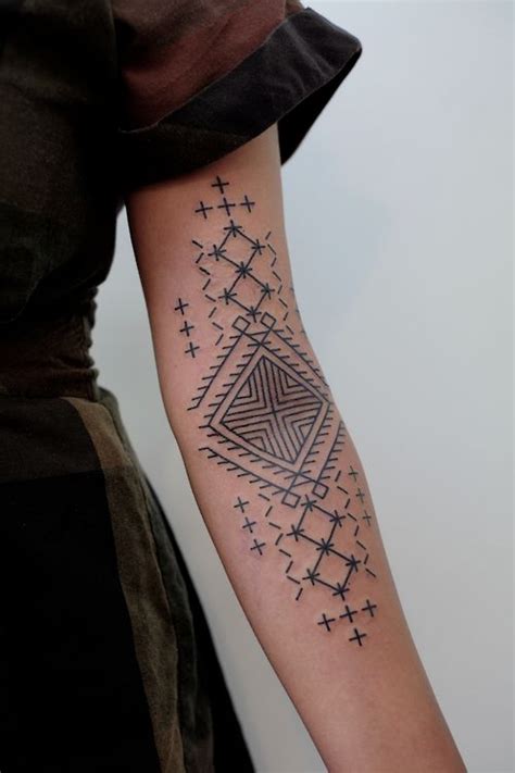 Black geometric tattoo on the left arm - Tattoogrid.net