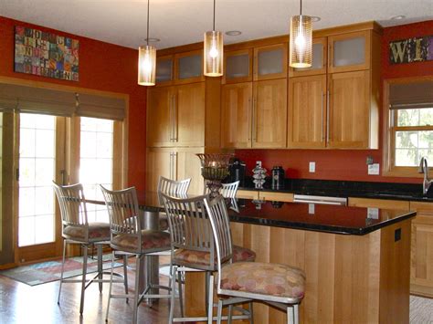 Kitchen painted in a warm terra cotta color. Barstools reupholstered ...