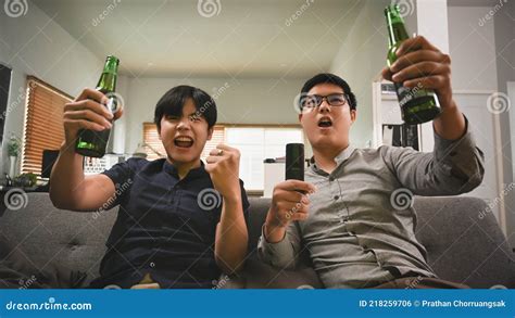 Excited Two Man Drinking Beer Cheering for Football on Sofa . Stock Photo - Image of friendship ...