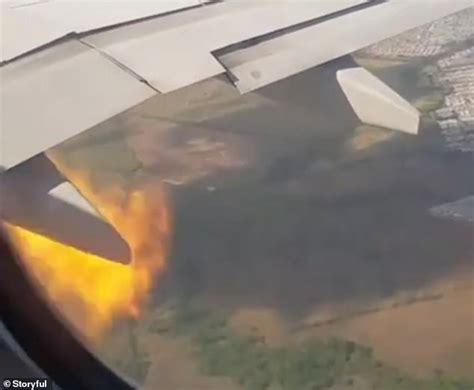 Air passenger films the terrifying moment plane engine catches fire ...