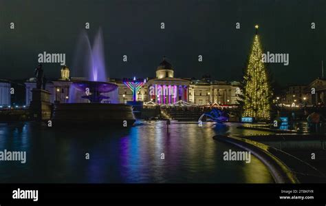 The newly lit christmas tree in Trafalgar Square alongside the menorah 2023, and the German ...