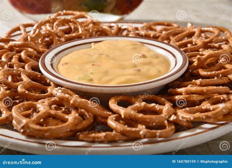 Pretzels and cheese dip stock image. Image of spicy - 160780159