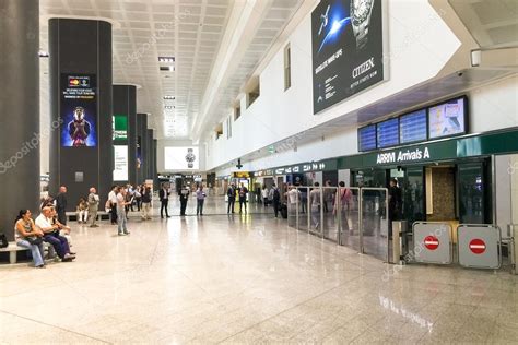 Malpensa International airport arrivals hall – Stock Editorial Photo © elesi #117795846