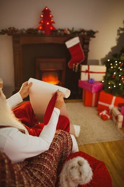 Premium Photo | Santa claus writing his list