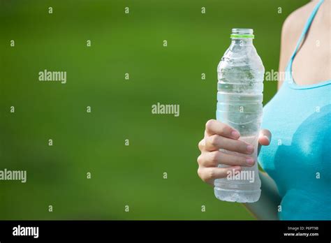 Girl drinking water exercise Stock Photo - Alamy