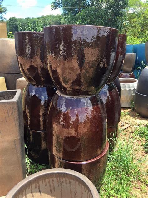 The durability and shiny glazes of brown outdoor ceramic pots can show you the amazing skills of ...