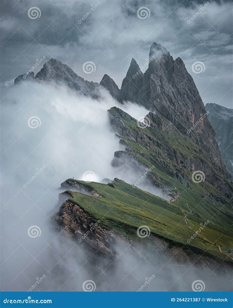 Vertical Shot of the Seceda Mountain Covered in the Fog in Winter in Italy Stock Image - Image ...