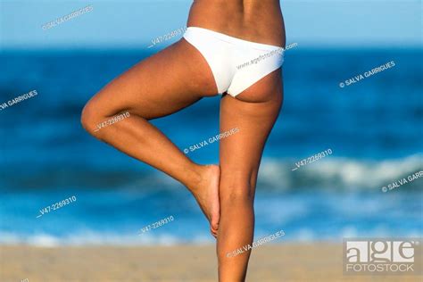 Woman performing balance exercises on the beach, Stock Photo, Picture And Rights Managed Image ...