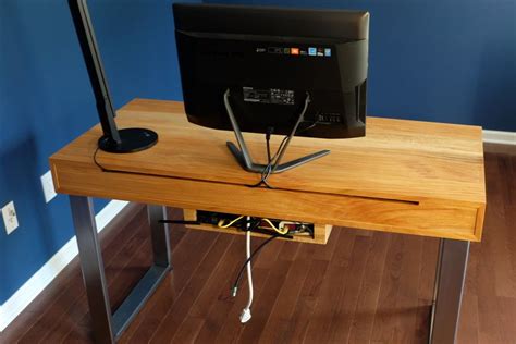 DIY Modern Computer Desk with Integrated Cable Management. Cavities in the back hold a power ...