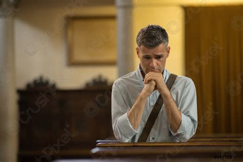 Man praying in the Church - stock photo | Crushpixel