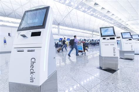 Self service machine and help desk kiosk at airport for check in, printing boarding pass or ...