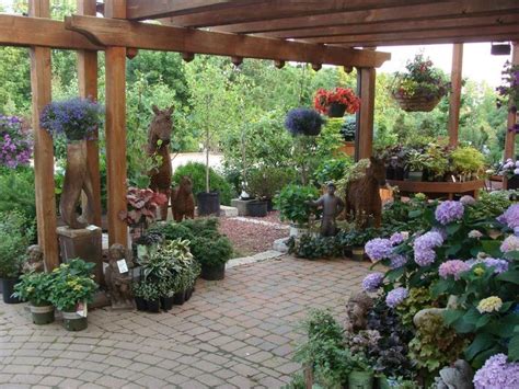 Pin by Brandi Young on displays | Garden center displays, Landscaping around patio, Garden styles