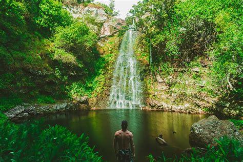 HD wallpaper: man standing in front of waterfalls during day time, man standing in front of ...