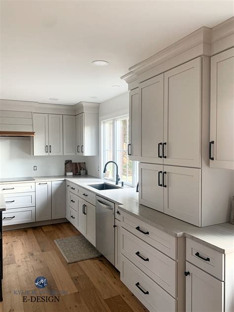 Transform Your Kitchen with White Cabinets, Black Countertops, and Wood ...