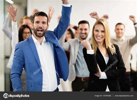 Happy business people celebrating success Stock Photo by ©nd3000 137040382