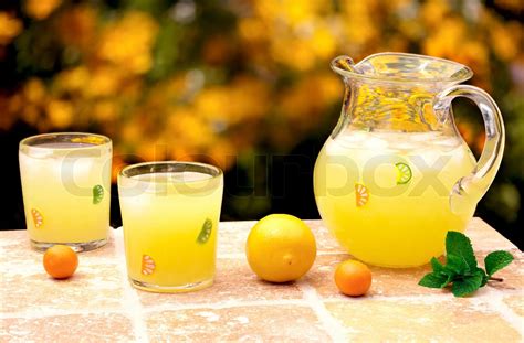 Fresh Squeezed Lemonade On Table With Colorful Orange and Green Background | Stock image | Colourbox