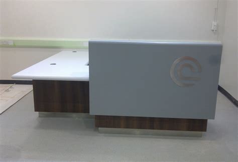 Hospital – Reception desk with laminated timber base and Corian cladding - Bacchus bespoke ...