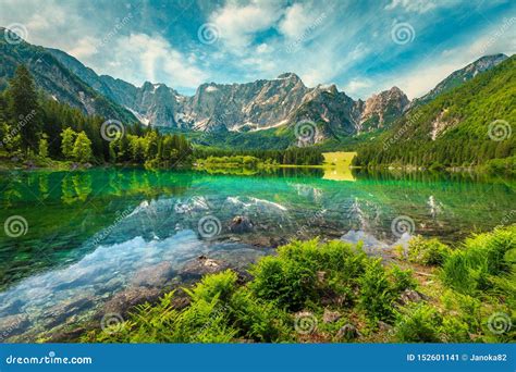 Alpine Landscape with Lake Fusine and Mount Mangart, Italy Stock Image ...