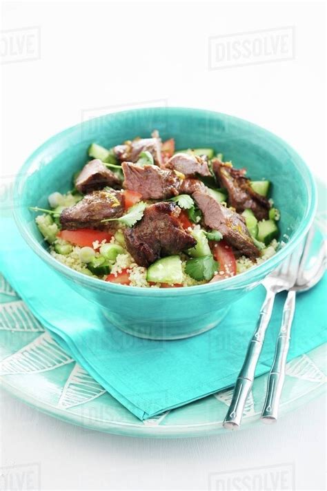 Couscous salad with cucumber, tomatoes and beef - Stock Photo - Dissolve