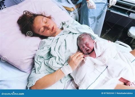 Mother Holding Her Newborn Baby after Labor in a Hospital. Stock Photo ...