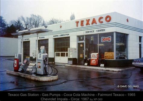 an old texaco gas station in the rain