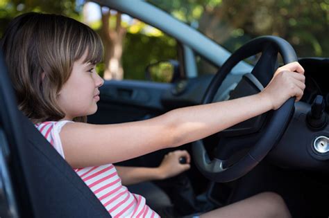 Teenage Girl Driving A Car Stock Photo - Download Image Now - 10-11 ...