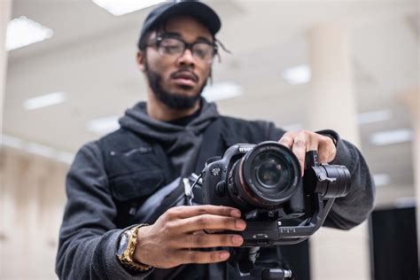 human man using black Canon DSLR camera person Image - Free Stock Photo