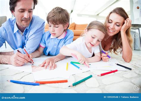 Family drawing together stock photo. Image of cute, looking - 139559548