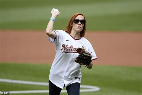 White House Press Secretary Jen Psaki throws the first pitch at Nationals Stadium one day after ...