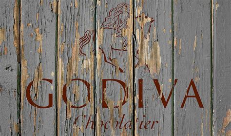 Godiva Vintage Logo on Old Wall Mixed Media by Design Turnpike