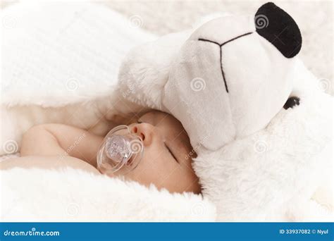 Closeup Photo of Sleeping Baby with Bear Stock Photo - Image of closeup ...