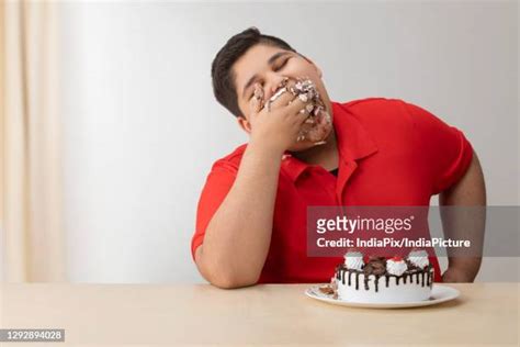 Fat Kid Eating Cake Photos and Premium High Res Pictures - Getty Images