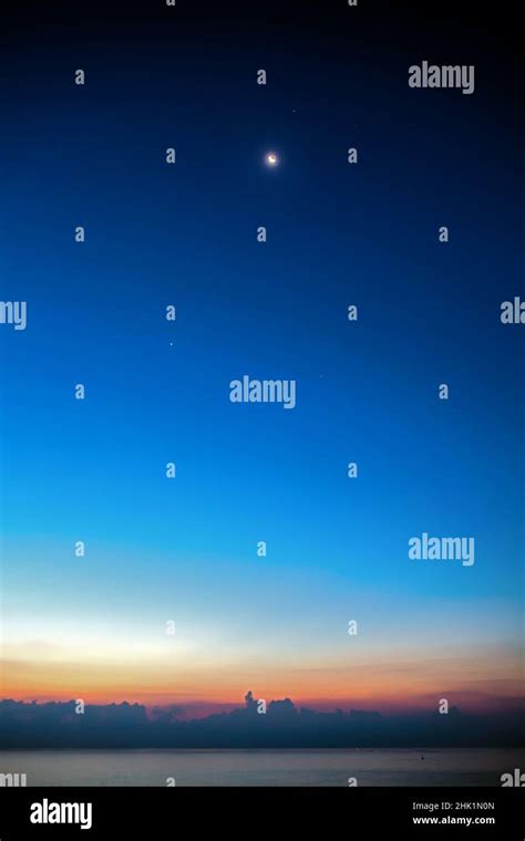 Crescent Moon in conjunction with Venus and Mars Stock Photo - Alamy