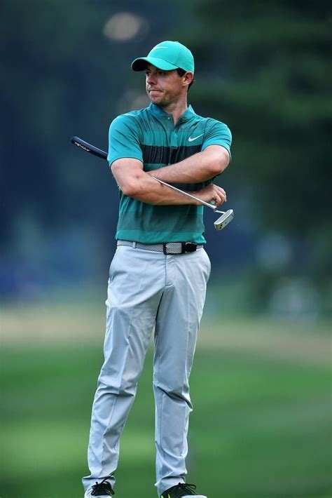 Rory McIlroy wearing Nike MM Fly Swing Knit Stripe Alpha Polo in Rio Teal, Nike Modern Tech ...