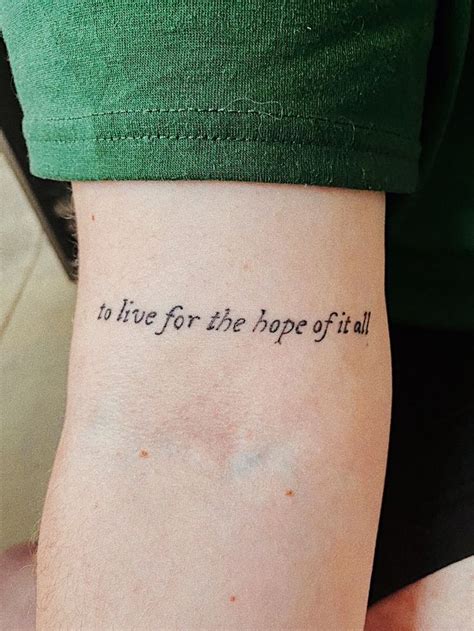 a person with a tattoo on their arm that says i love for the hope of all