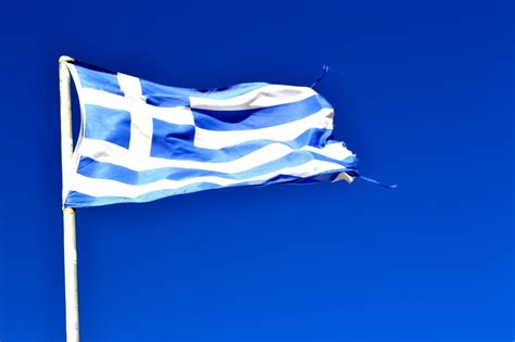 waving blue and white flag under blue sky during daytime free image | Peakpx