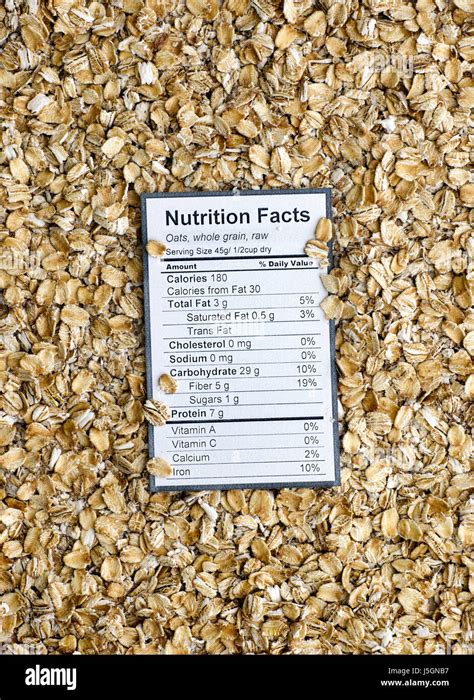 Nutrition facts of whole grain raw oats with oats background Stock Photo - Alamy