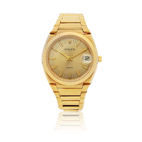 ROLEX | 'THE TEXAN' QUARTZ, REF 5100 BETA 21 YELLOW GOLD WRISTWATCH WITH DATE AND BRACELET CIRCA ...