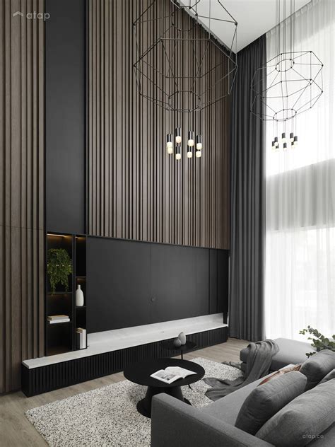 a modern living room with black walls and white carpeted flooring, gray couches, large ...